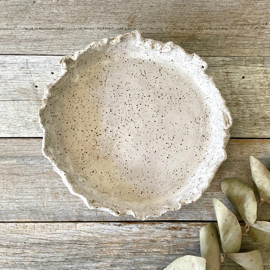 Dish with ruffled edge. Handmade pottery, rustic ceramic, speckled clay with white glaze, nordic inspired design. Made by Colours on Grey