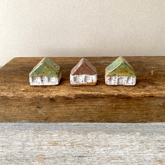 A collection of 3 cute tiny cottages with door, windows and decorations on all sides 55-08