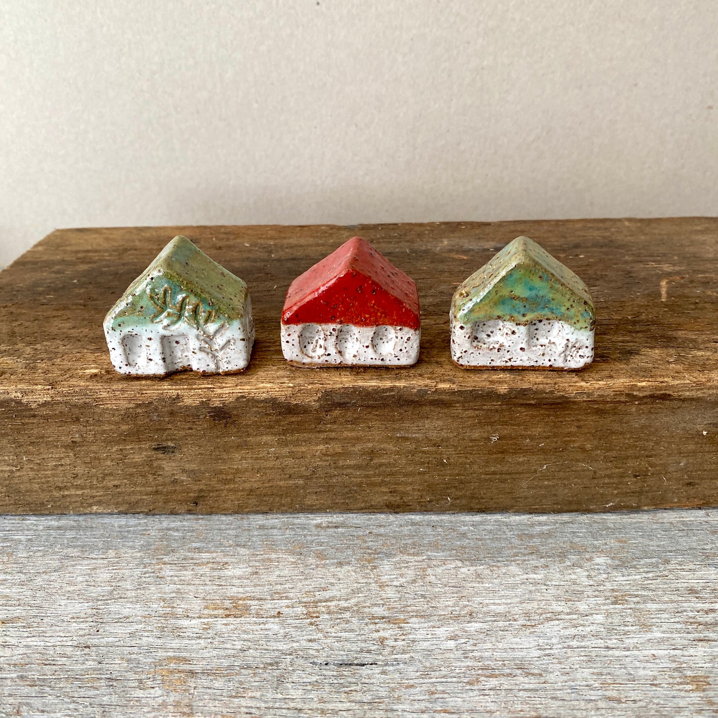 A collection of 3 cute tiny cottages with door, windows and decorations on all sides 55-07