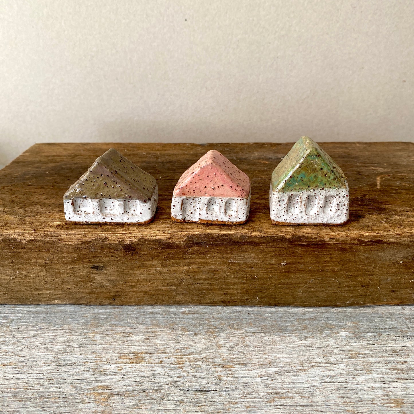 A collection of 3 cute tiny cottages with door, windows and decorations on all sides 55-05