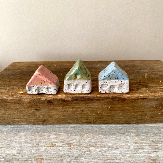 A collection of 3 cute tiny cottages with door, windows and decorations on all sides 55-04