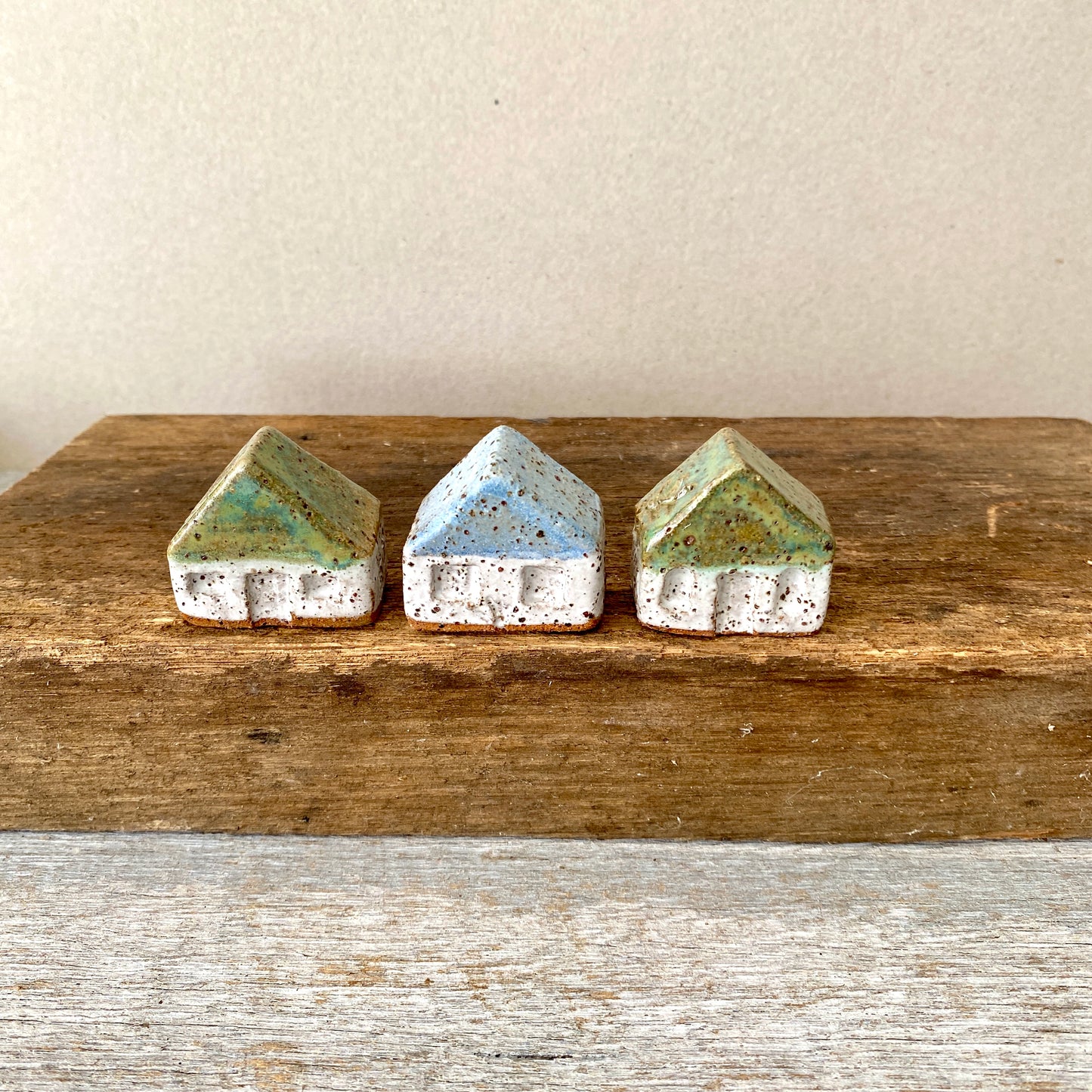 A collection of 3 cute tiny cottages with door, windows and decorations on all sides 55-03